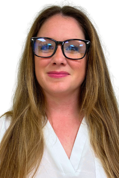 Photo of a person with blond hair and black glasses, smiling